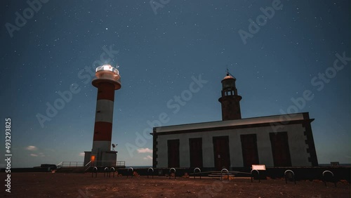 Lighthouse Fuencaliente at La Palma, Canary Island, timelaspe with stars photo