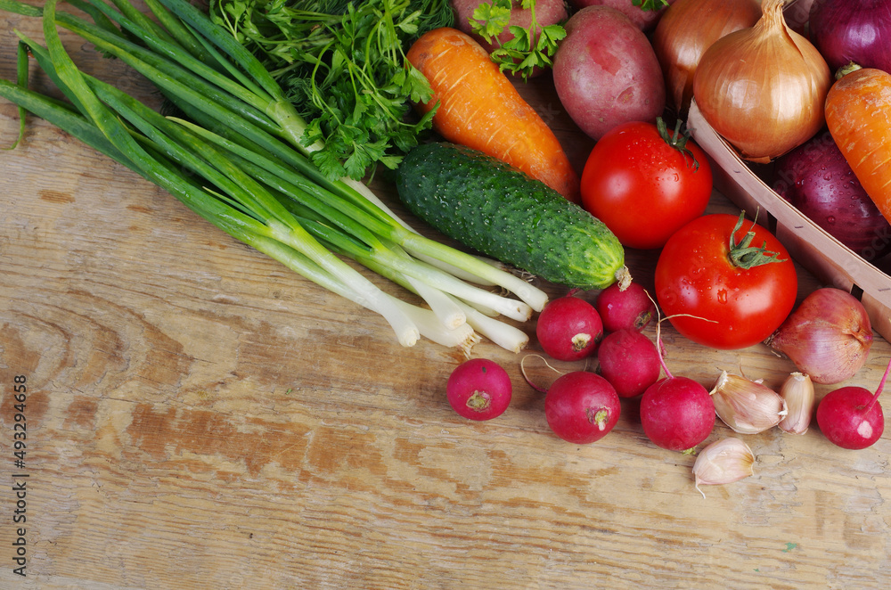 Fresh vegetables on a wooden texture table. Fresh vegetables on a wooden texture table.
