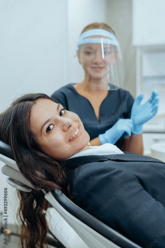 Patient woman consulting a dentist Patient woman consulting a dentist