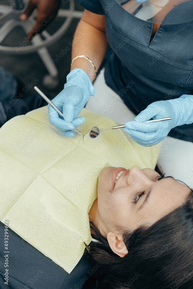 Dentist and patient in dentist office Dentist and patient in dentist office