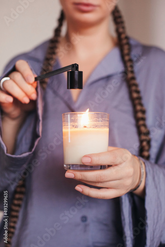 Anonymous woman is ready to stifle the candle 