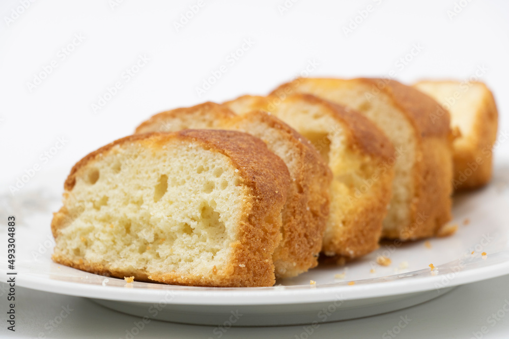 some slices of pound cake in a plate in white background