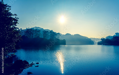 Morning sunrise near backwaters and green forest