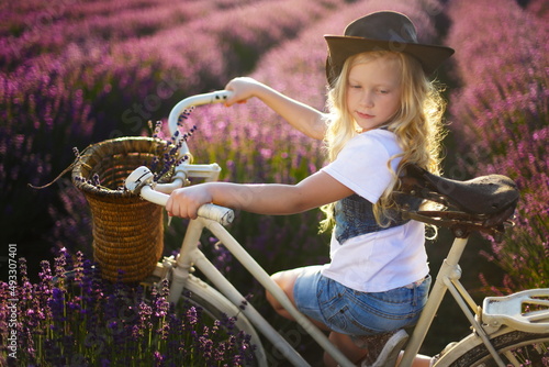 girl on bicicle lavender photo