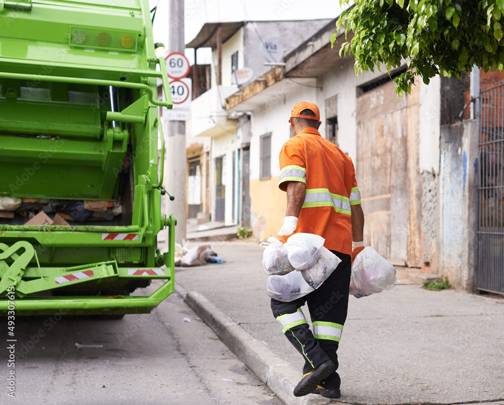Hes keeping our streets clean. Cropped shot of a male worker on garbage day.