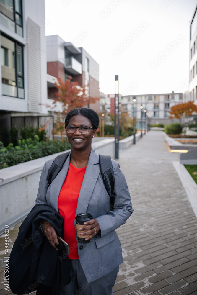 Portrait near office buildings in business suit. Portrait near office buildings in business suit.