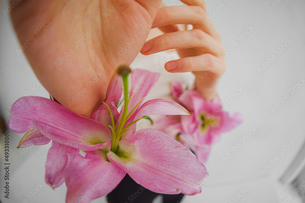 Woman's Hand With Flowers Close Up Woman's Hand With Flowers Close Up
