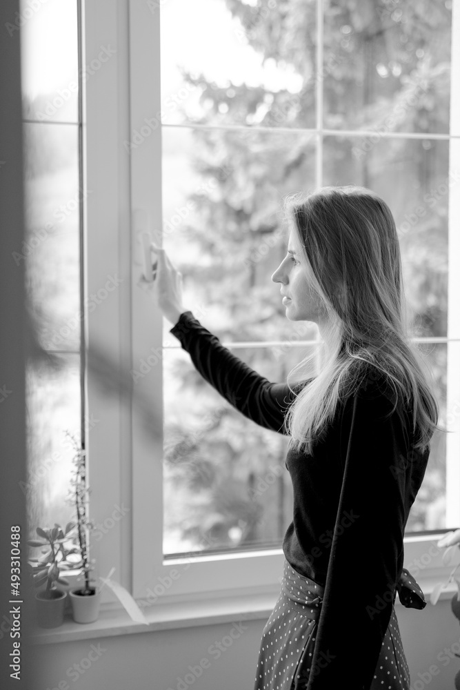 Thoughtful Woman Looking Through Window Thoughtful Woman Looking Through Window