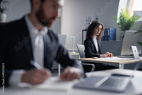 Female broker acquaint oneself with trade documents