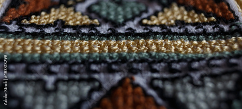 Closeup of an ornament of the Ukrainian embroidered shirt. Ukrainian national clothes. Culture of Ukraine. Macro photo. Vyshyvanka.