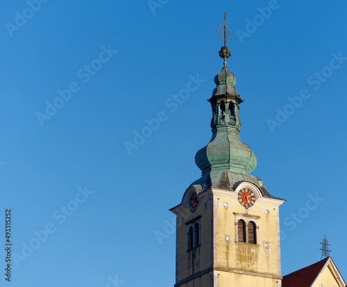 Church steeple a beautiful Parish Church of Saint Anastasia in the town of Samobor, Croatia against a blue sky 
