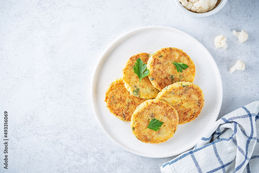 Cauliflower burgers with carrot and parsley