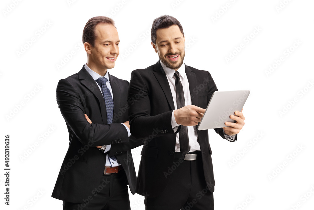 Businessman showing a digital tablet to another man Businessman showing a digital tablet to another man