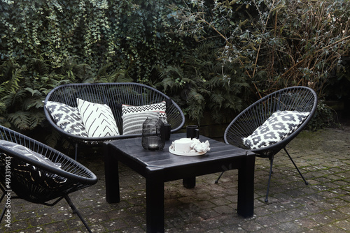 black lounge chairs in the garden