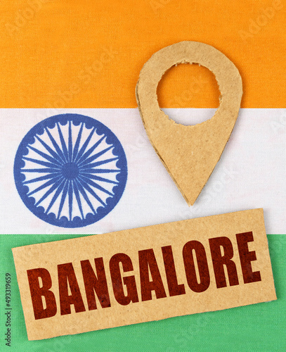 On the Indian flag, a geolocation symbol and a sign with the inscription - Bangalore photo