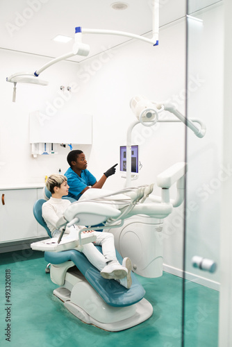 Dentist examining teeth scans photo