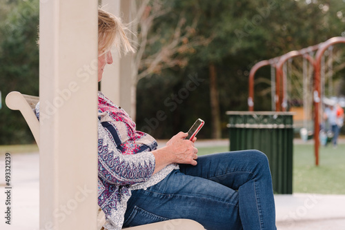 Trendy senior on mobile device