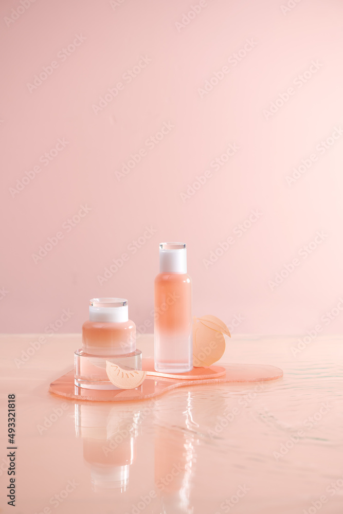 Two blank cosmetics containers and water. Two blank cosmetics containers and water.