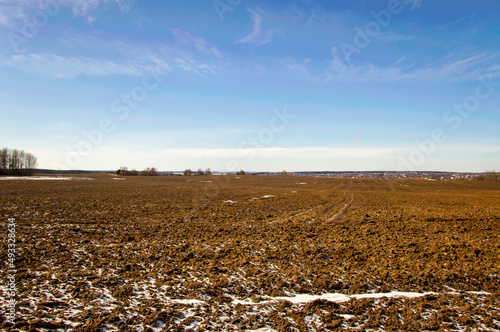 Spring landscape with empty fields and meadows for background. Agricultural industry