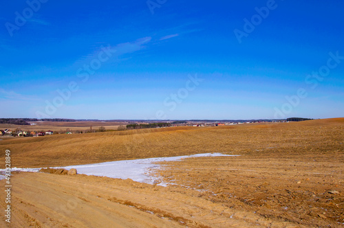 Spring landscape with empty fields and meadows for background. Agricultural industry