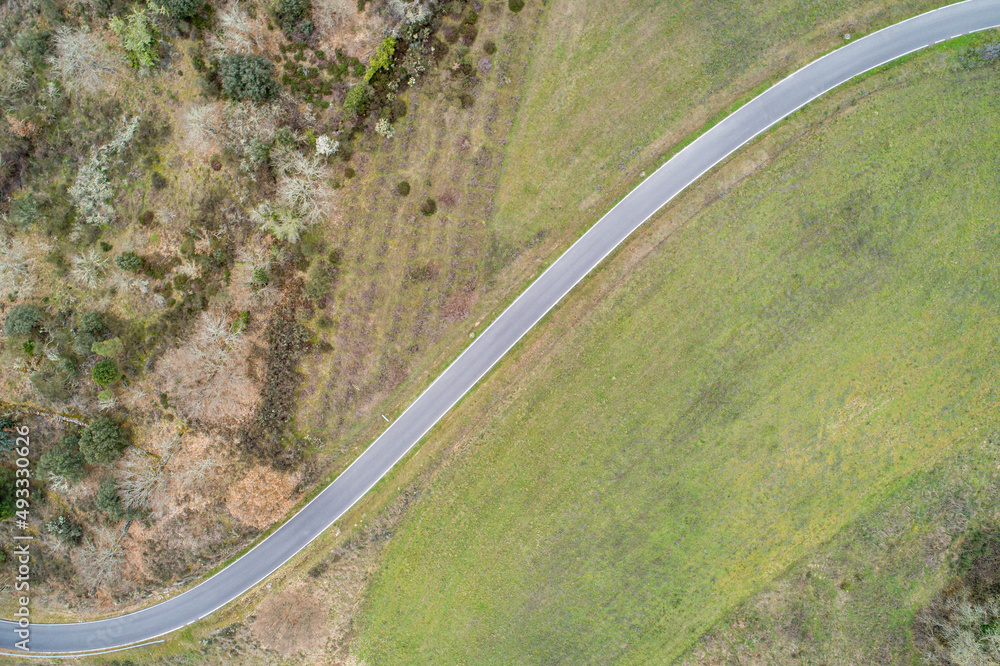 road section with two curves as seen from a drone