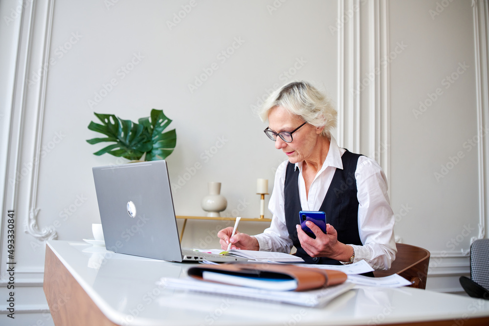 Mature woman accountant counts taxes, Mature woman accountant counts taxes,