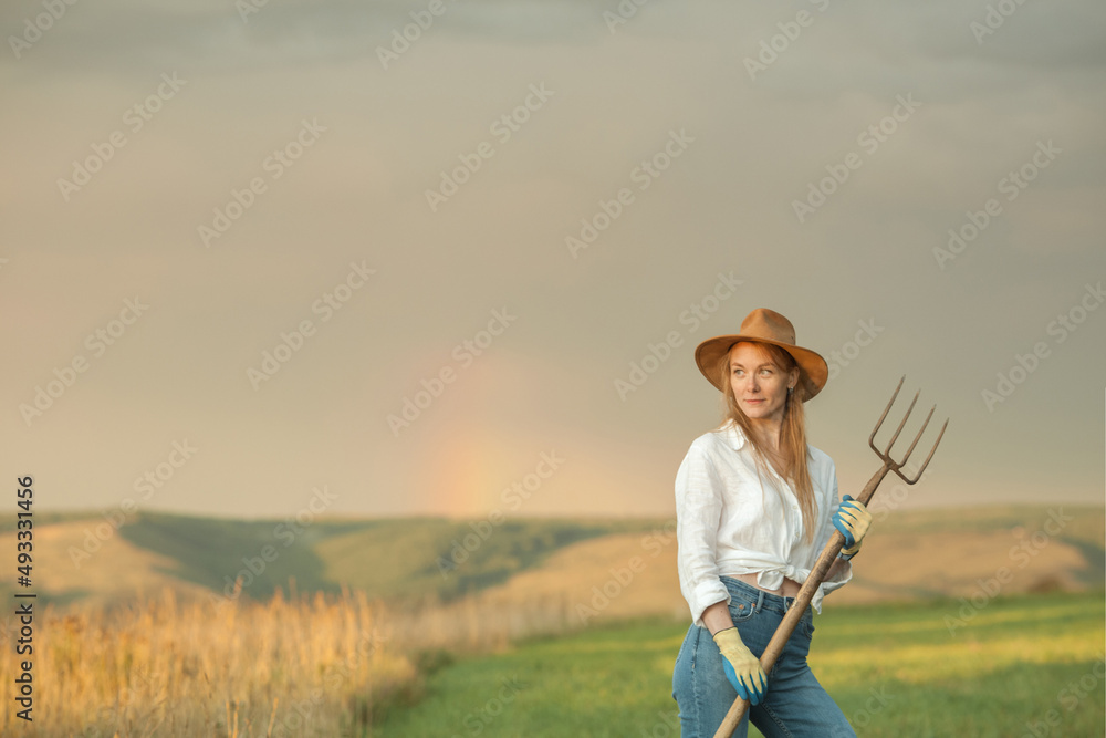 Country woman in field with pitchfork. Harvest festival Country woman in field with pitchfork. Harvest festival