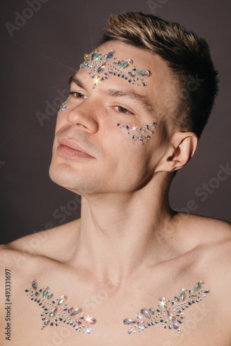 Beauty portrait of Man with rhinestones photo