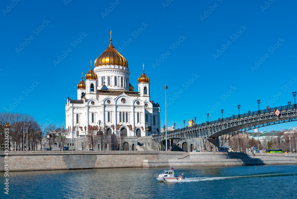 Moscow. Russia. Rescue boat of the Ministry of Emergency Situations on the Moscow River against the background of the Cathedral of Christ the Savior and the Patriarchal Bridge