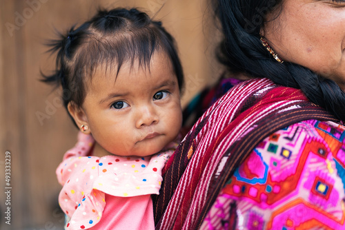 Beautiful Guatemalan girl with her mother photo