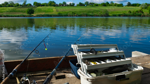 Wallpaper Mural Zheltoe village, Dnipropetrovsk region, Ukraine - May 01, 2021: Fishing with a rod on the lake. Fishing tackle. Torontodigital.ca