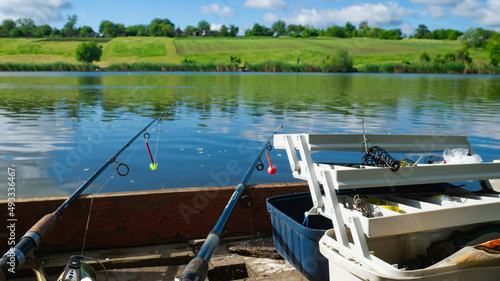 Wallpaper Mural Zheltoe village, Dnipropetrovsk region, Ukraine - May 01, 2021: Fishing with a rod on the lake. Fishing tackle. Torontodigital.ca