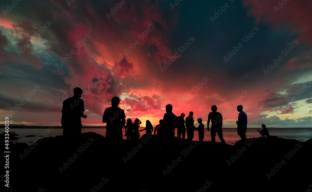 Friends gathering silhouettes at sunset Friends gathering silhouettes at sunset