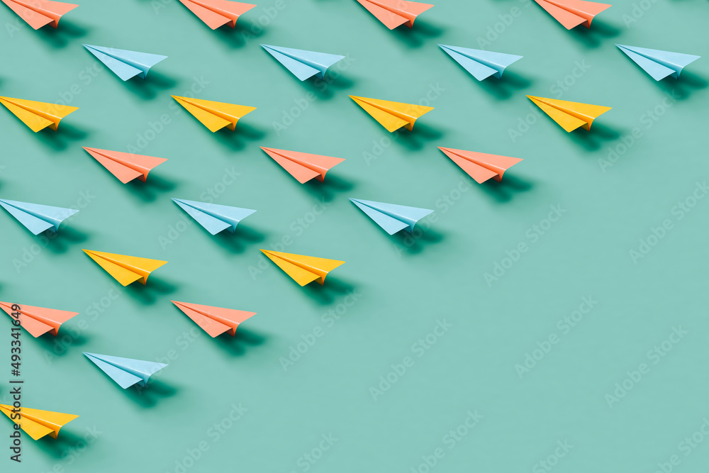 paper planes in pastel colors with copy space. Stock Photo Adobe Stock