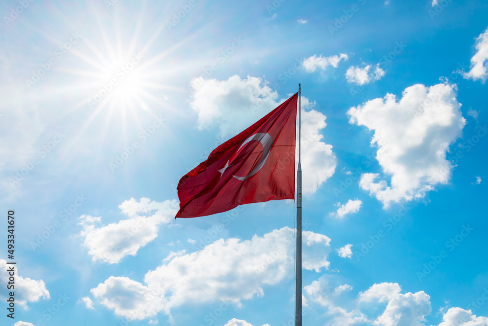 Turkish flag. Sunny summer day white clouds and blue sky. Turkish flag. Sunny summer day white clouds and blue sky.