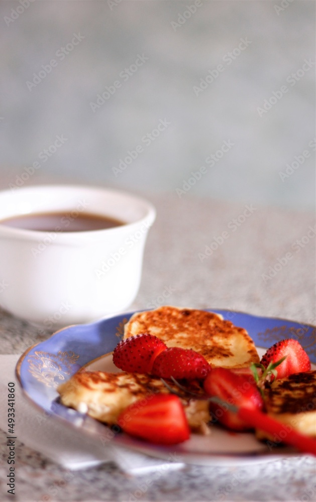 Closeup pancakes with strawberries food eat delicious sweet dessert bakery tasty pastry nobody sugar cup table Closeup pancakes with strawberries food eat delicious sweet dessert bakery tasty pastry nobody sugar cup table
