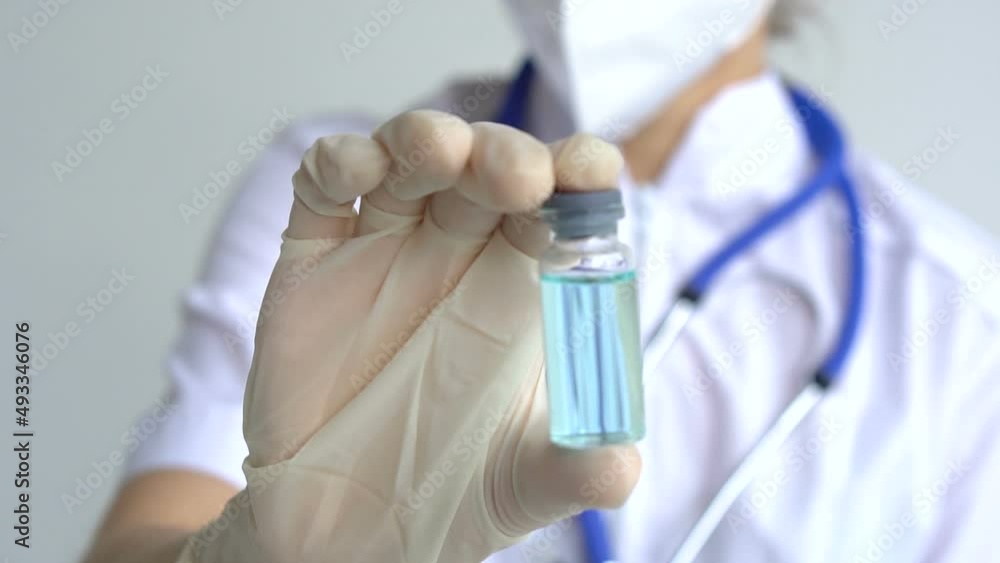 Infectious doctor show COVID 19 vaccine for prevention, immunization and treatment for new corona virus infection. Medical technology concept Infectious doctor show COVID 19 vaccine for prevention, immunization and treatment for new corona virus infection. Medical technology concept