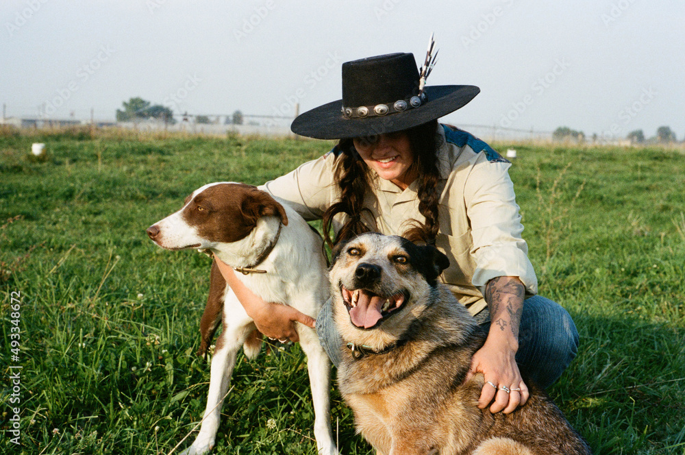 cowgirl relaxes with cowdogs cowgirl relaxes with cowdogs