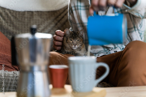 Hygge moment with coffee and cat at home photo