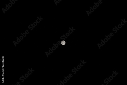 Full moon on dark night sky background © yarm_sasha