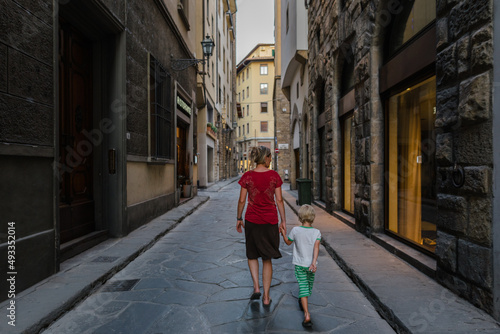 Mother and son on a street in Florence