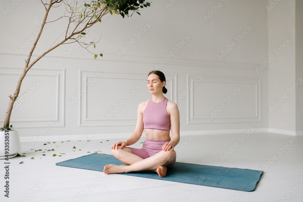 Young Woman Meditating Indoors Young Woman Meditating Indoors