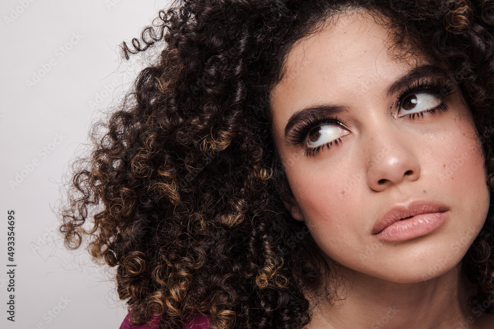 Model with curly hair and sparkly eyeshadows Model with curly hair and sparkly eyeshadows