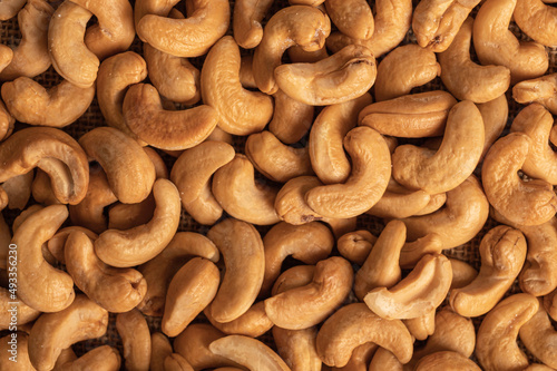 Roasted cashew nuts texture background.