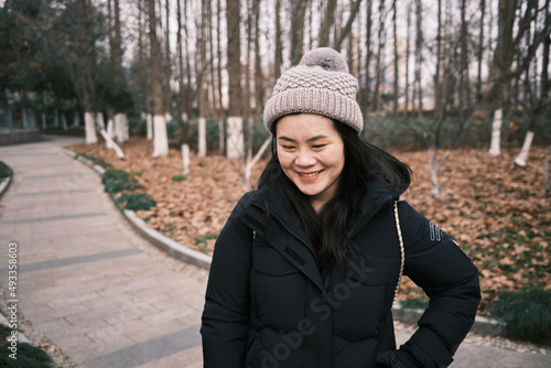 Happy Chinese Woman Laughs Away From Camera photo