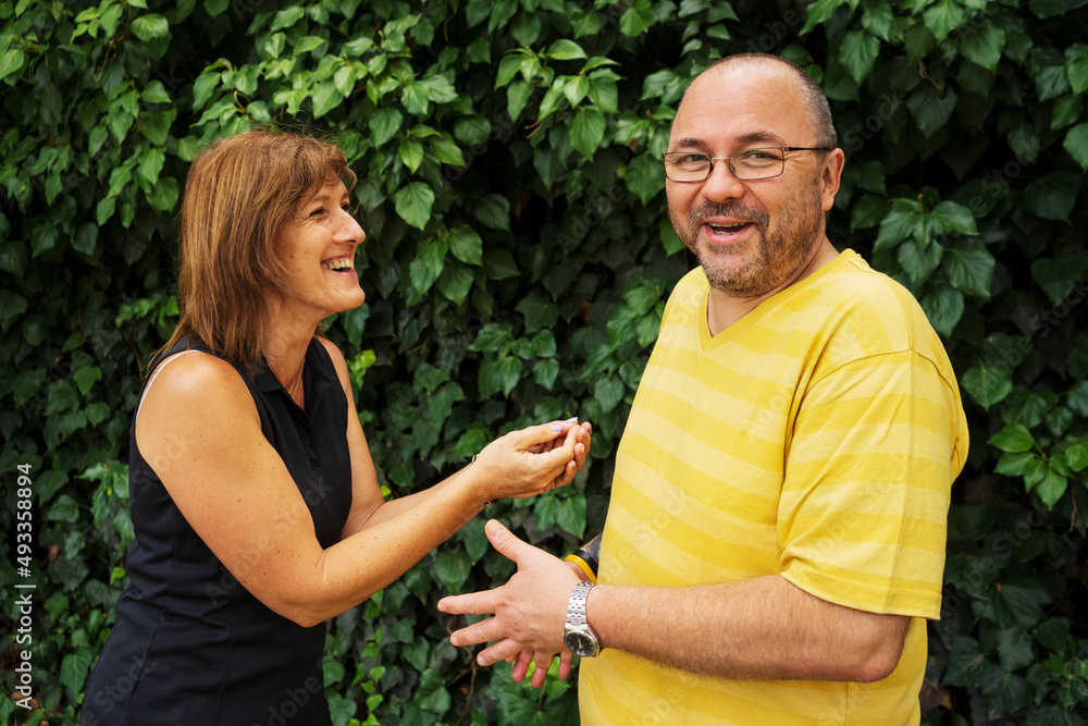 Couple in the garden talking Couple in the garden talking
