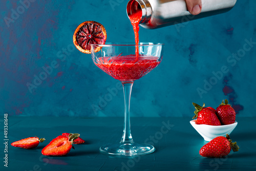 Wallpaper Mural Anonymous hand is pouring strawberry cocktail or juice from mug or shaker. Includes copy space. Torontodigital.ca