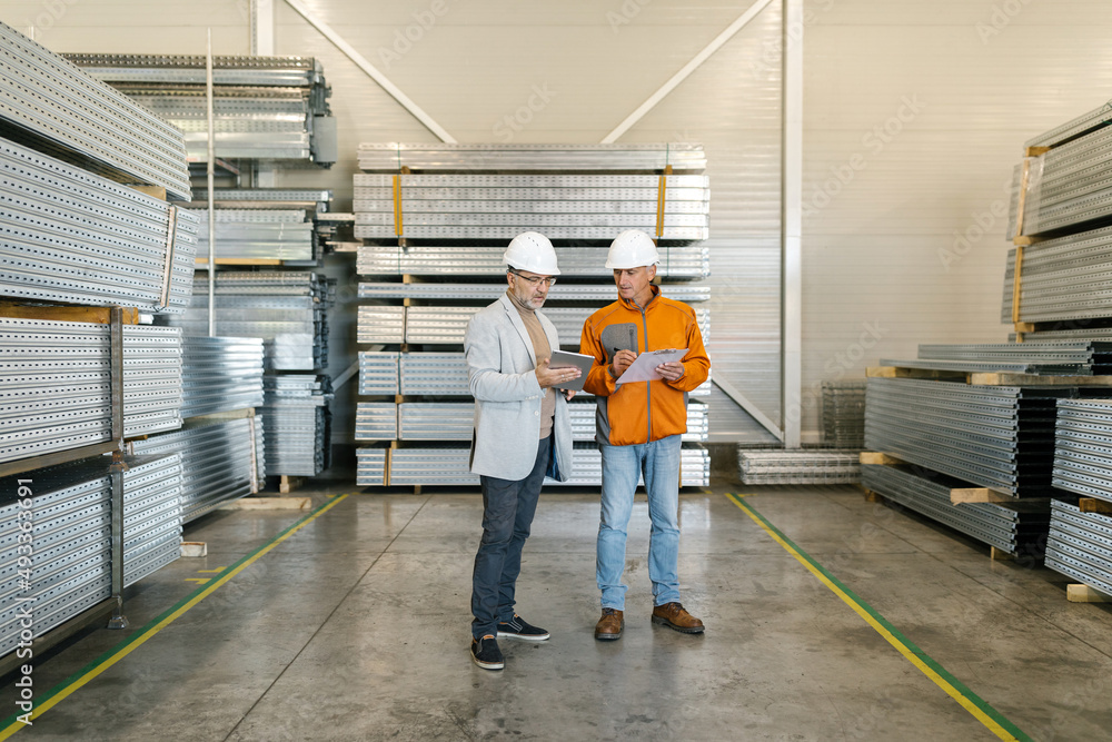 Manager Working With A Worker In A Factory Manager Working With A Worker In A Factory