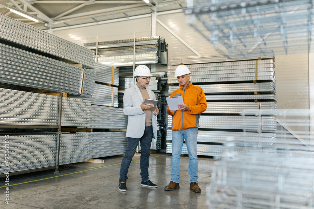 Supervisor In A Factory Inspection With A Worker Supervisor In A Factory Inspection With A Worker