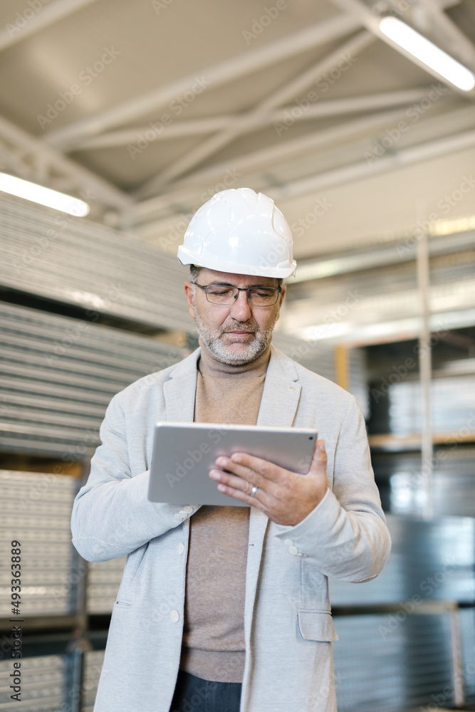Supervisor Using Tablet In A Factory Supervisor Using Tablet In A Factory